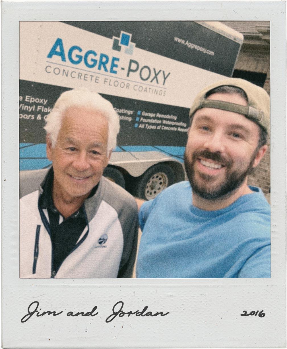 Polaroid of Jim and Jordan in front of their first Aggrepoxy trailer wrap, 2016