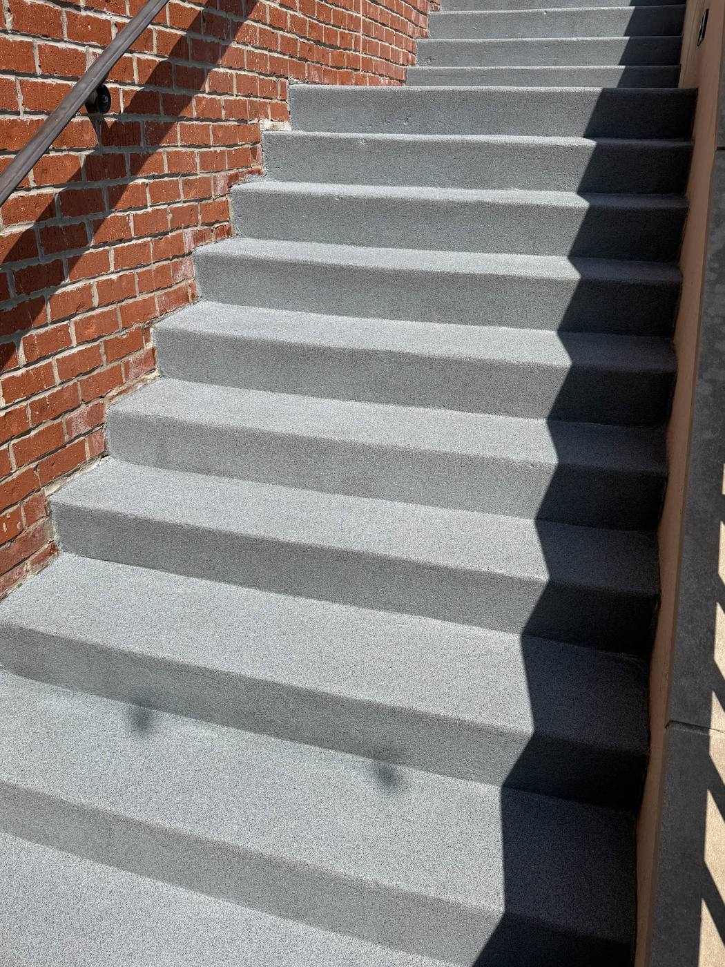 Coated exterior walkway and stairs
