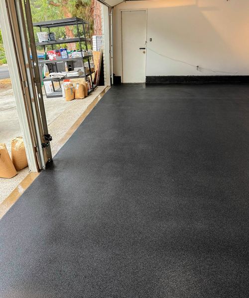 Dark flake garage floor with door open