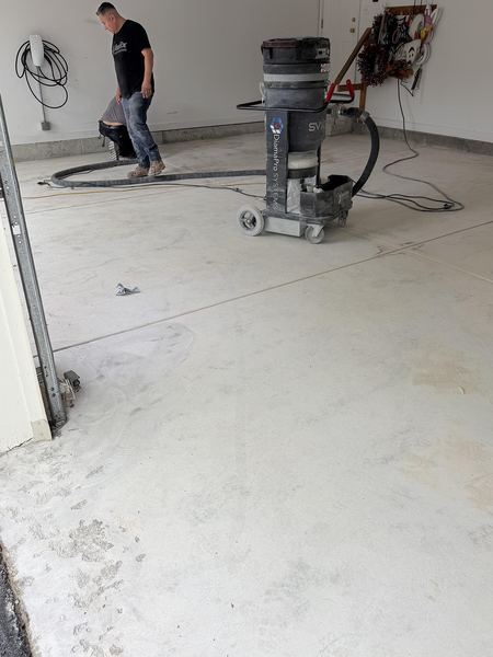 Diamond grinding a garage slab before coating