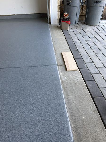 Clean coating edge where the garage meets the patio